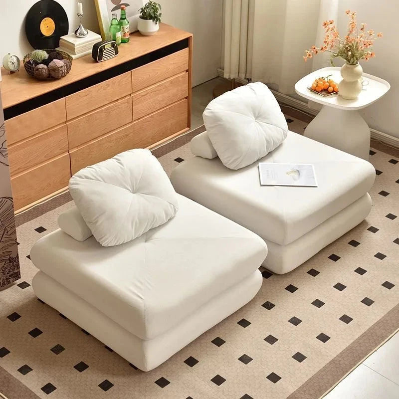 Modern convertible floor sofa bed folded into single seat